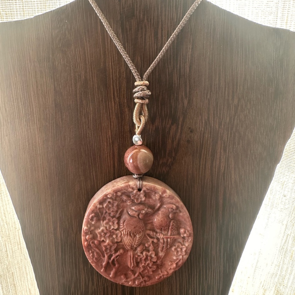 Coral Fossil Carved Round Bird Pendant Necklace on Tan Adjustable Rope - Picture 2 of 13